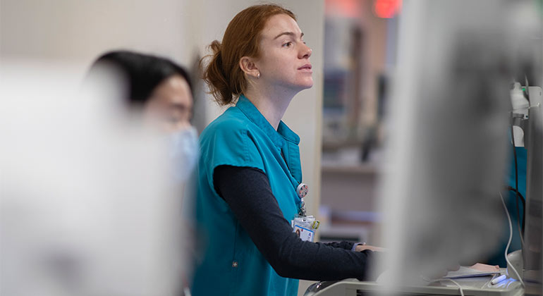 Image of nurse in hallway