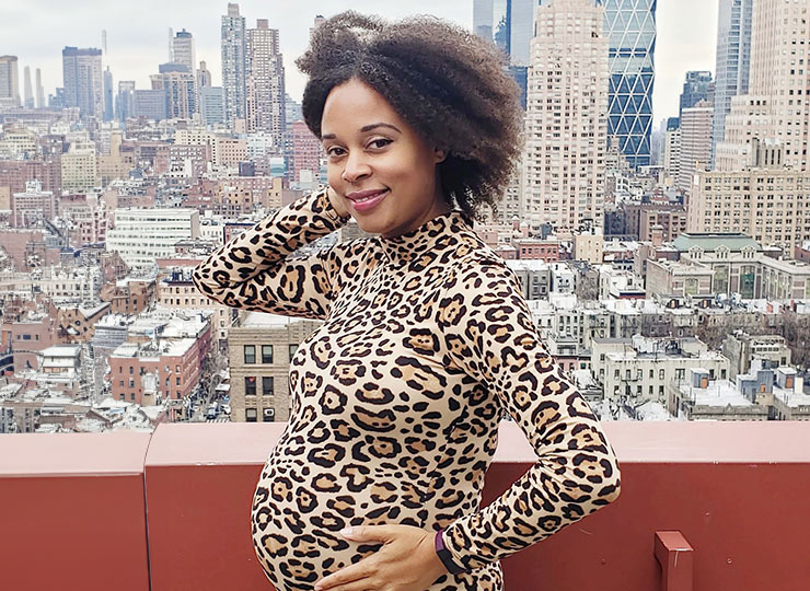 Photo of pregnant patient on rooftop overlooking city