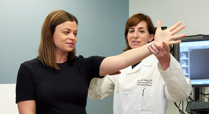 image of doctor examining patient