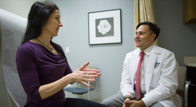 image of Dr. Hadjipanayis in consultation room with patient