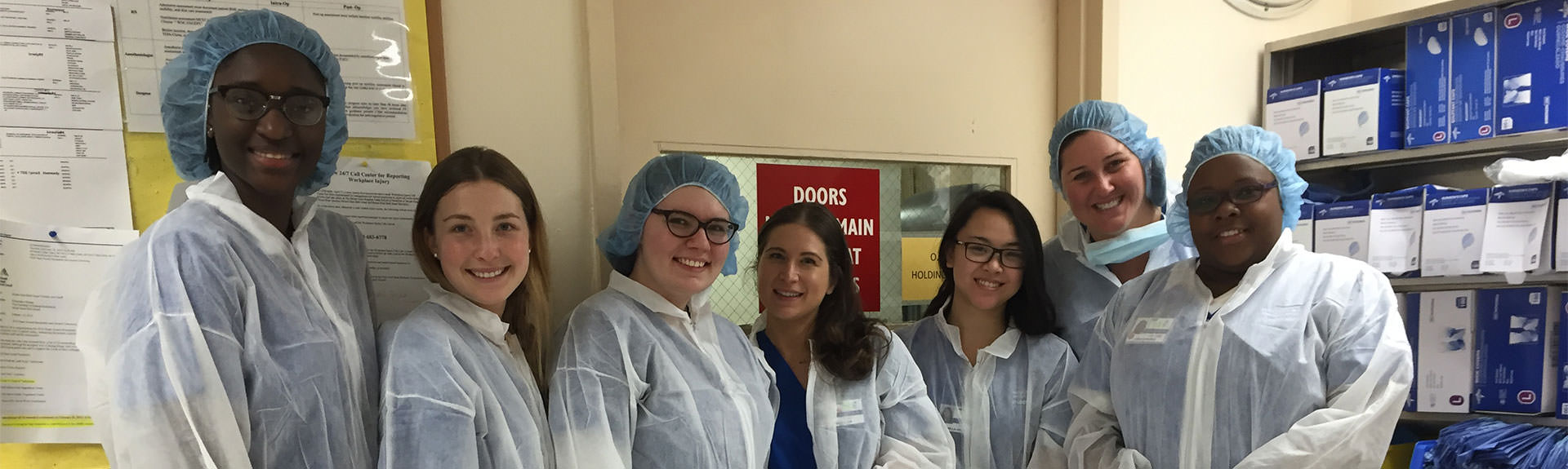 Nursing students in OR scrubs.