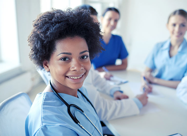 Nurse smiling with group.