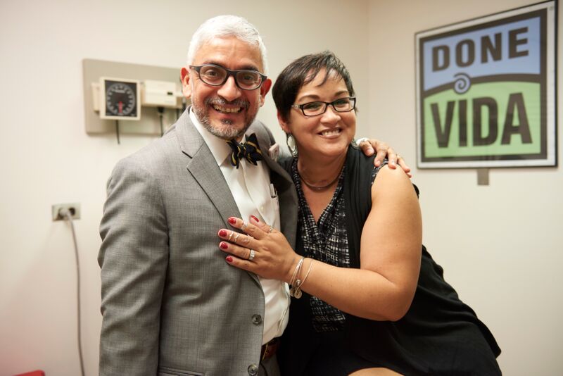 Woman hugging doctor