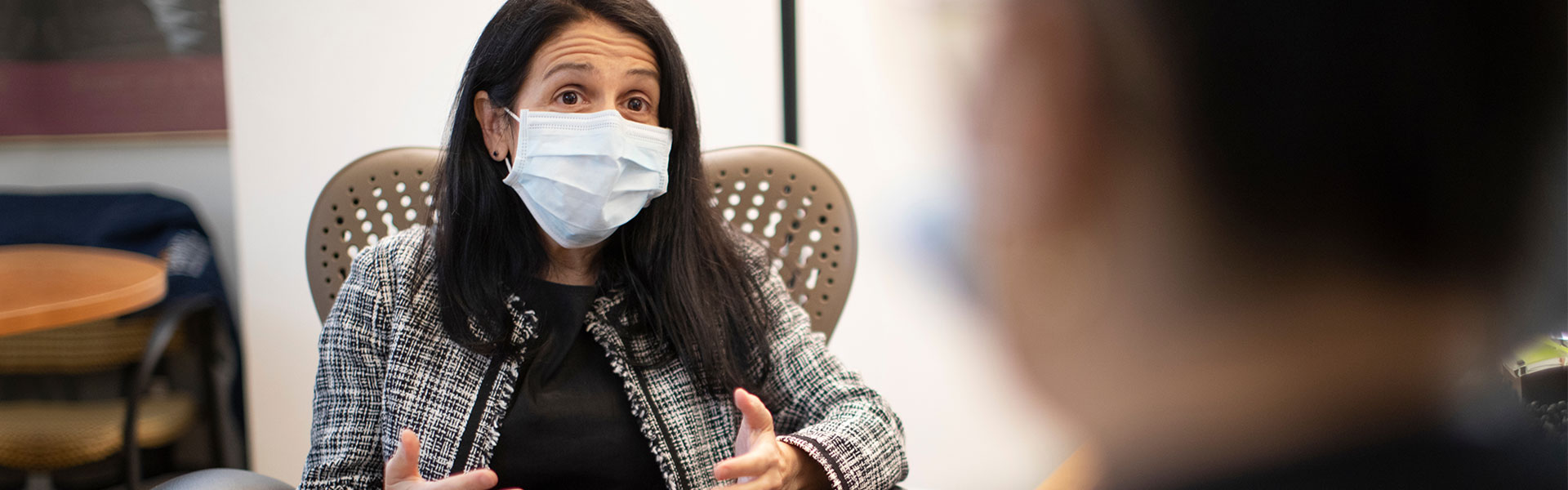 Masked doctor and patient