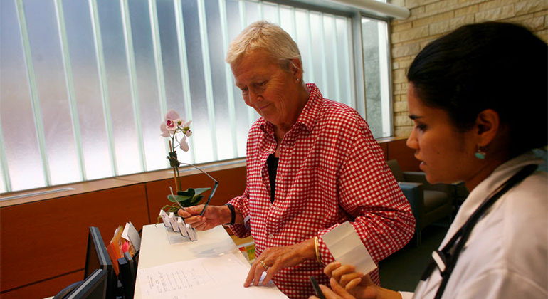 Photo of patient and Doctor at Front Desk