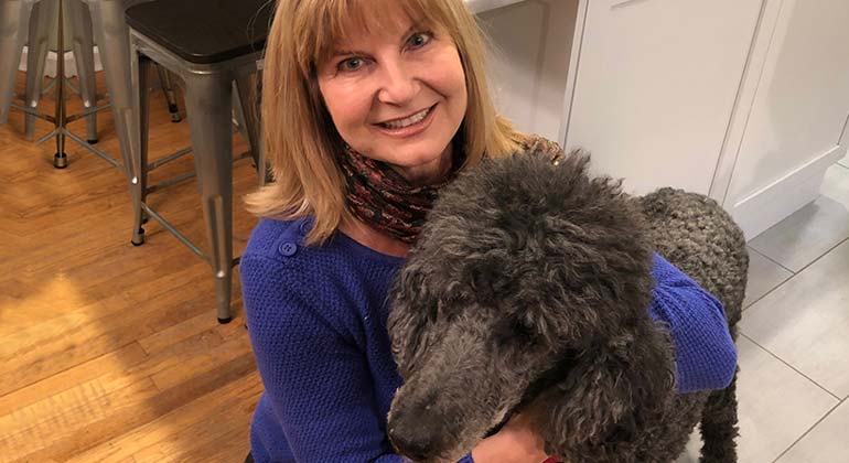 Lorraine Dibble holding her dog