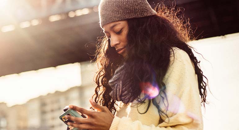 Woman booking a doctor’s appointment using Text-to-Chat