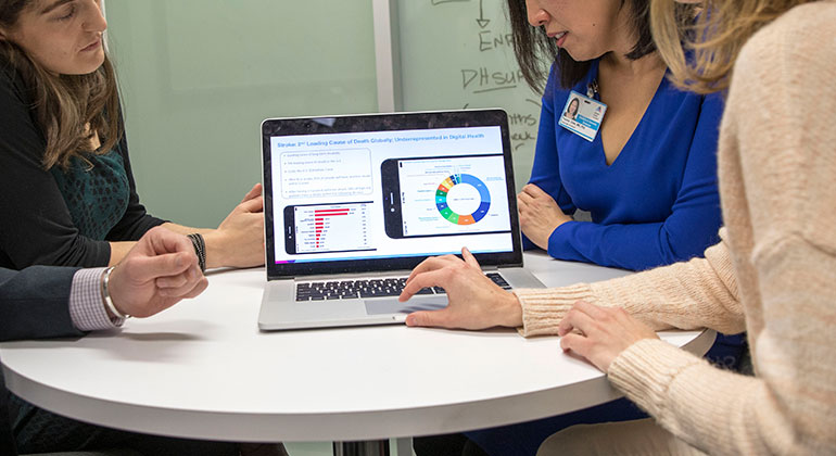 image of women looking at chart on computer