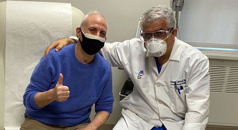 Masked doctor and patient