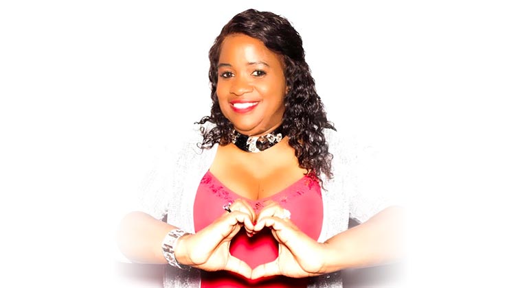 Patient making heart shape with her hands