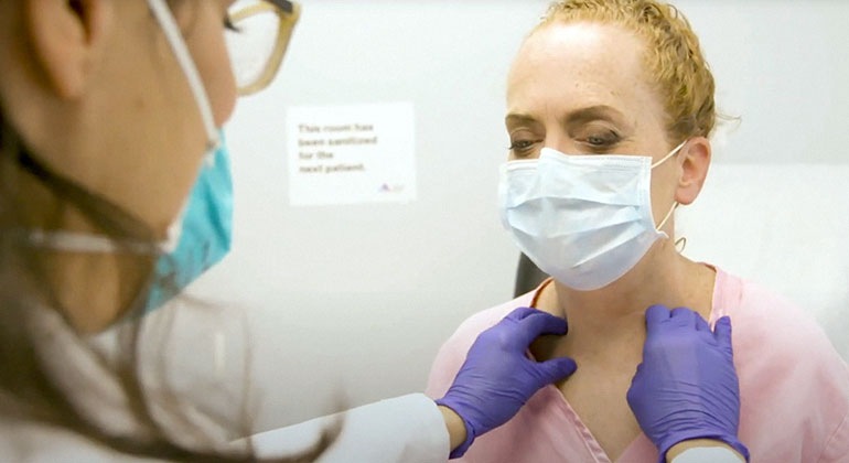 Masked patient and doctor