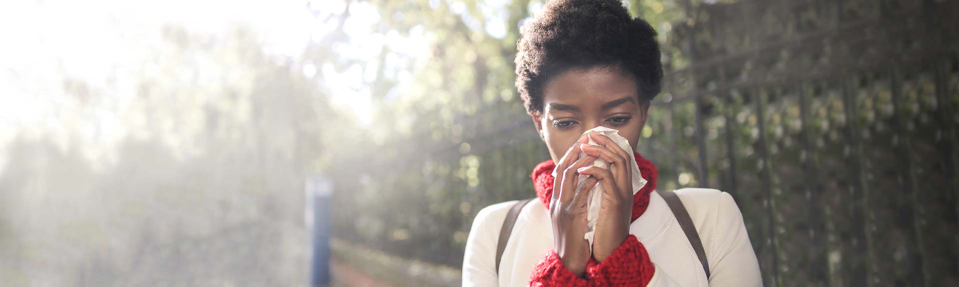 Woman blowing nose