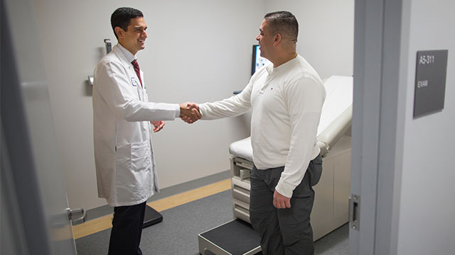 Doctor hand shaking his patient