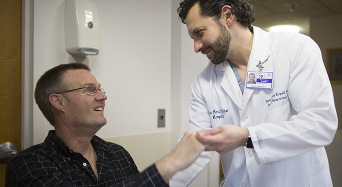 Doctor and patient shaking hands