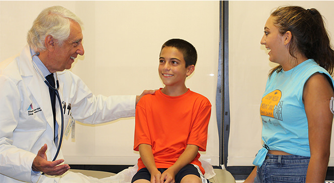 Doctor talking to two young patients