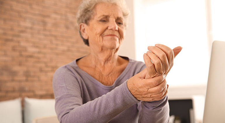 Woman rubbing wrist