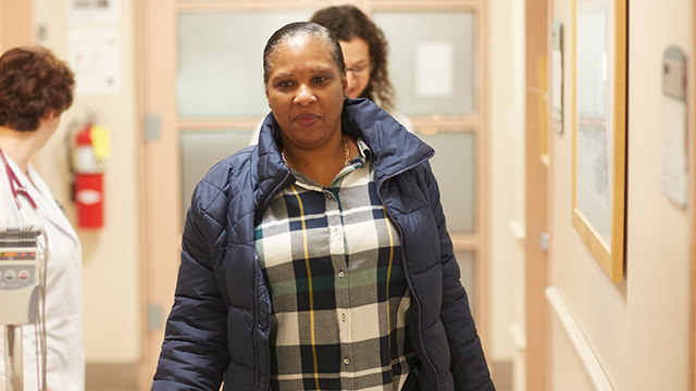 Woman walking down hallway