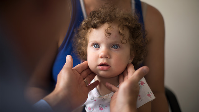 Doctor examining baby