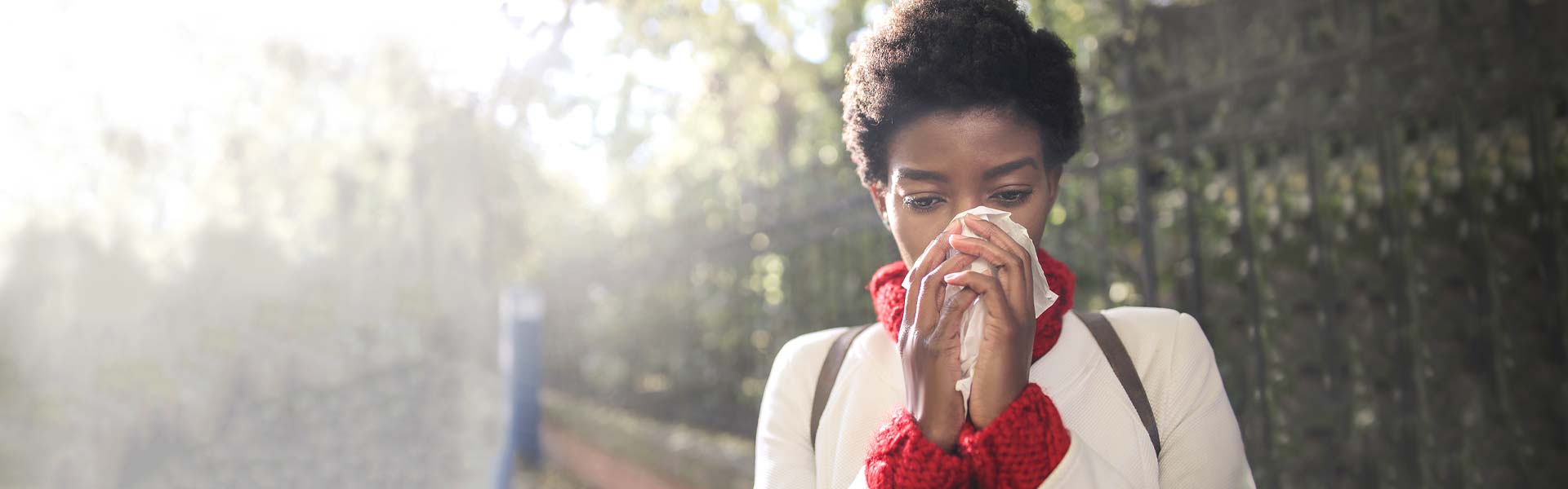 Woman blowing her nose