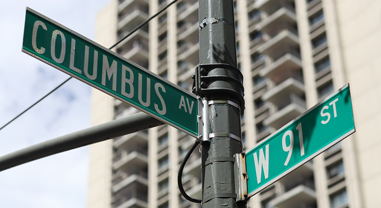 View of a two road intersection signs from outside