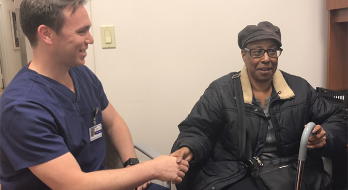 image of physician shaking hands with patient in office setting