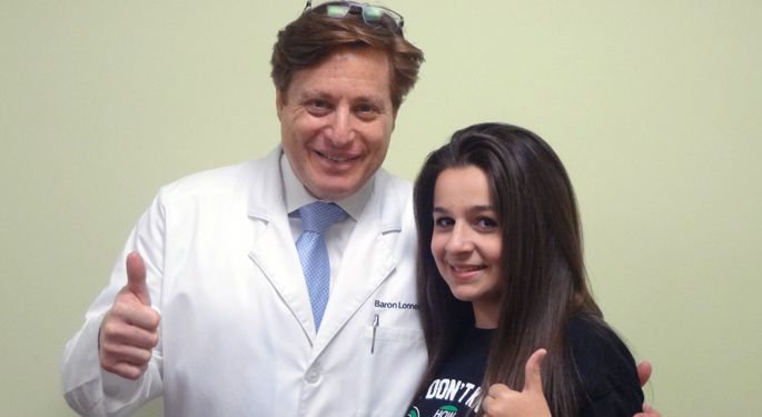 Orthopedic surgeon, Dr. Barron Lonner with teen Young Spine Program patient