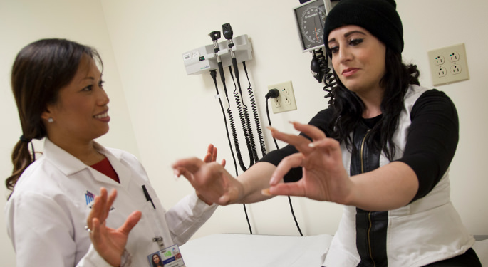 Image of Nurse Practitioner Joan Miravite with patient in the division of Movement Disorder