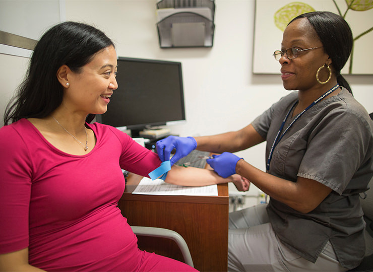 Photo of Pregnant woman having blood drawn