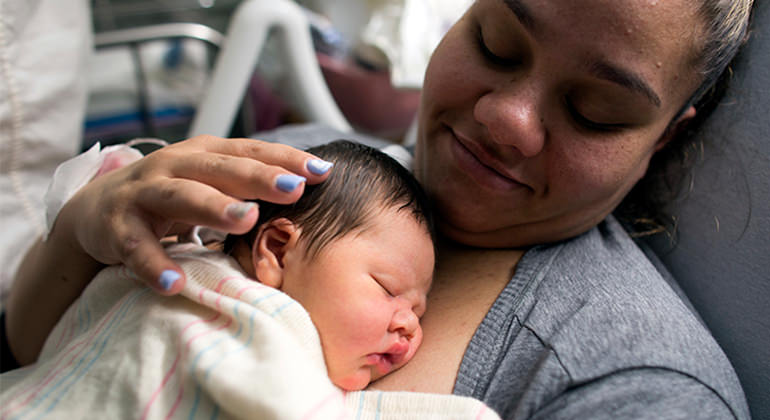 Mom holding newborn baby