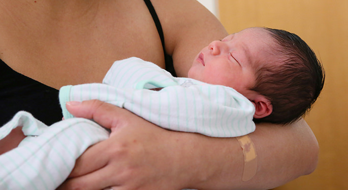 Woman holding new baby