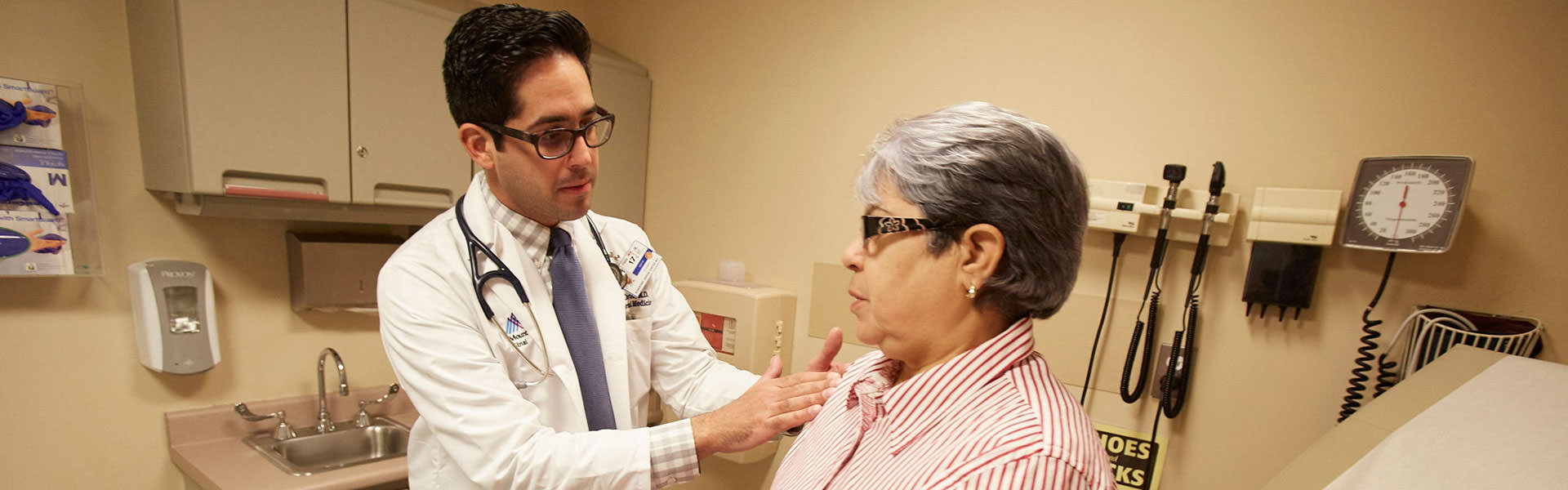 Image of doctor examining patient