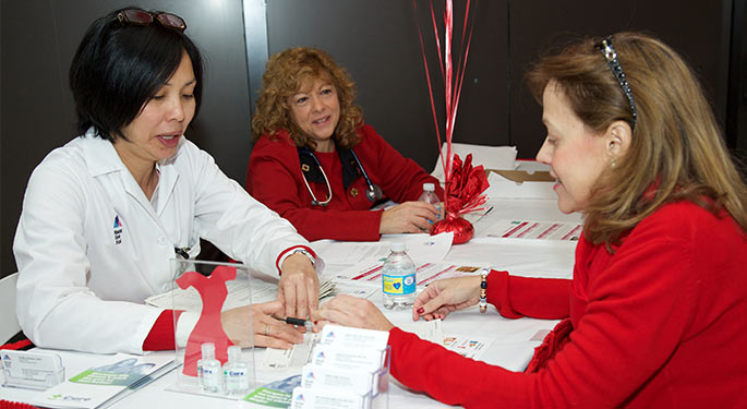 image of staff speaking with event attendee