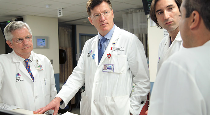 image of doctor John Puskas and colleges with patient