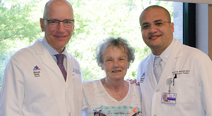 image of two doctors with a patient