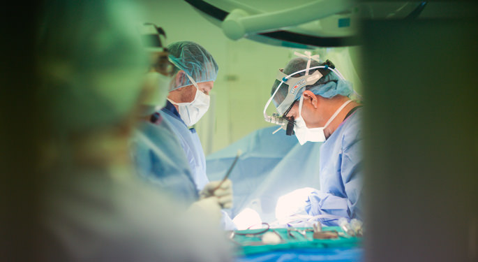 Image of orthopedic surgeons performing surgical procedure in operating room.