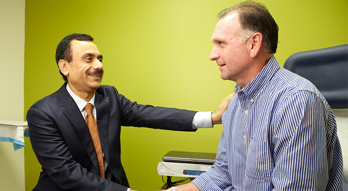 Image of doctor shaking hands with patient