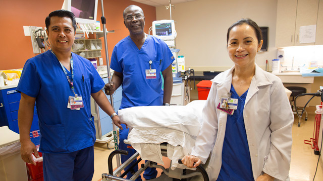 group of 3 nurses smiling