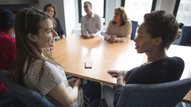 2 women talking to one another in support group