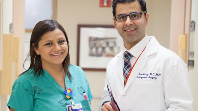 nurse and doctor smiling