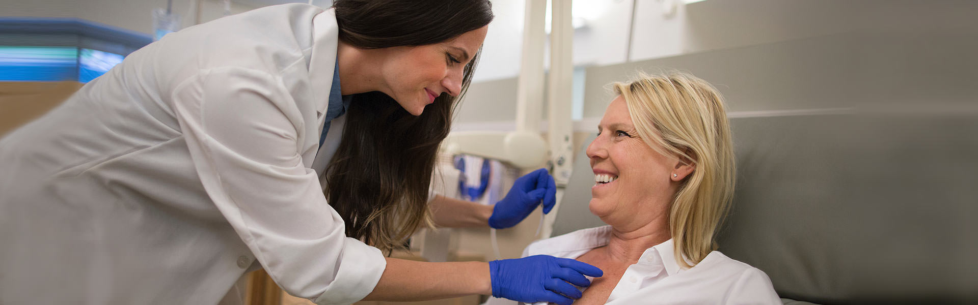 Image of doctor examining breast cancer patient