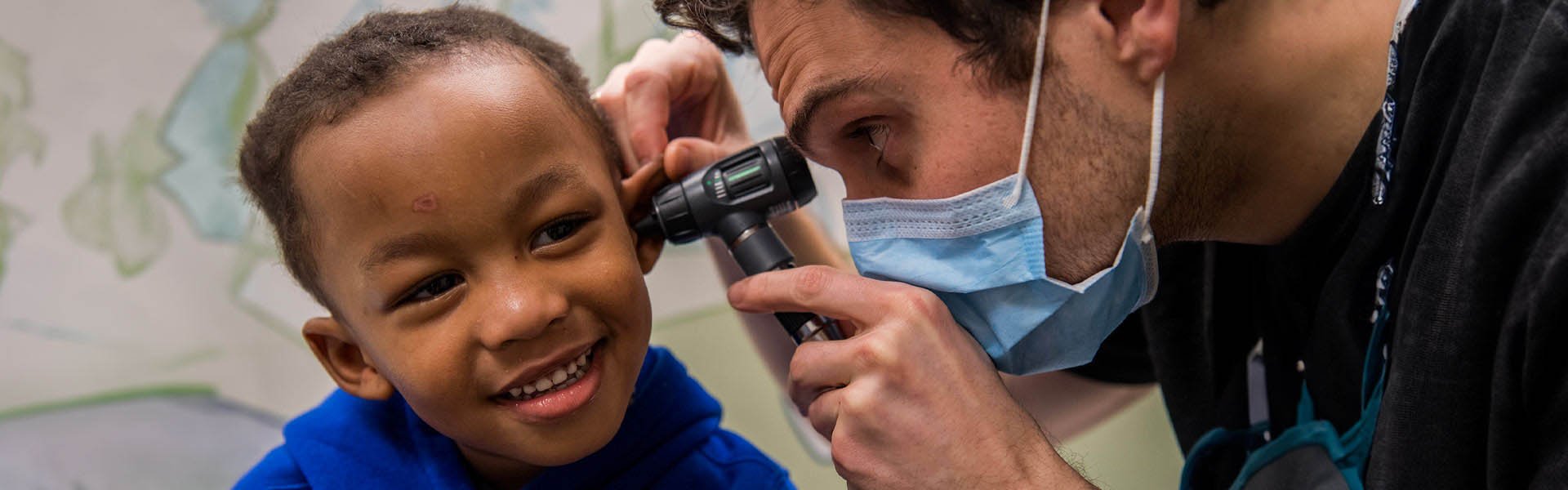 Image of doctor examining child
